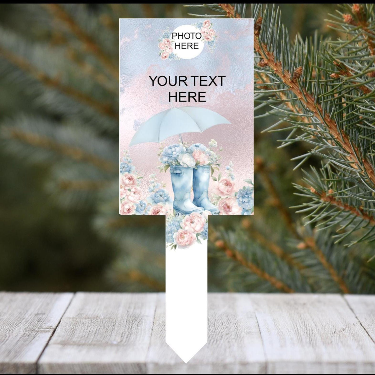 Personalised boots and umbrella graveside memorial tribute
