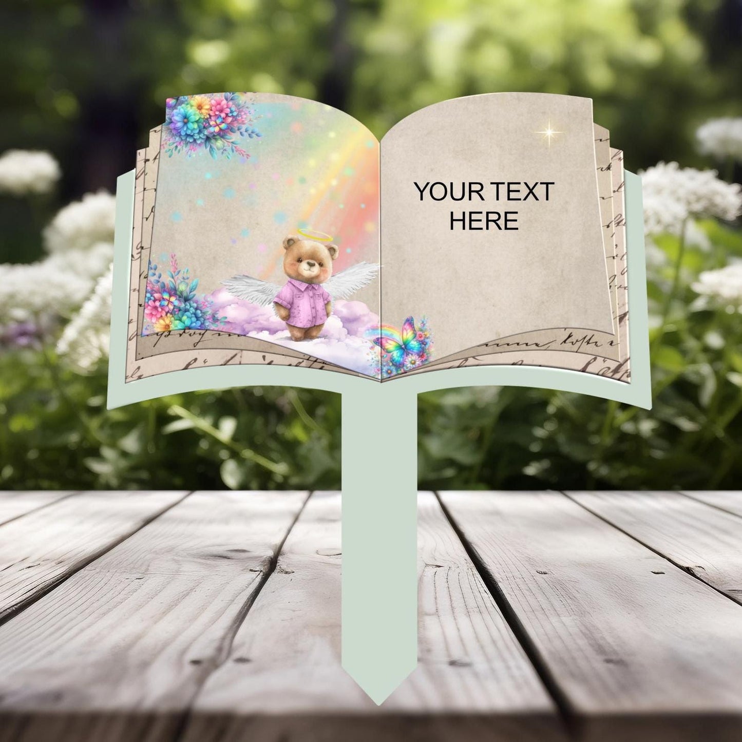 Open book child memorial grave marker with teddy bear design
