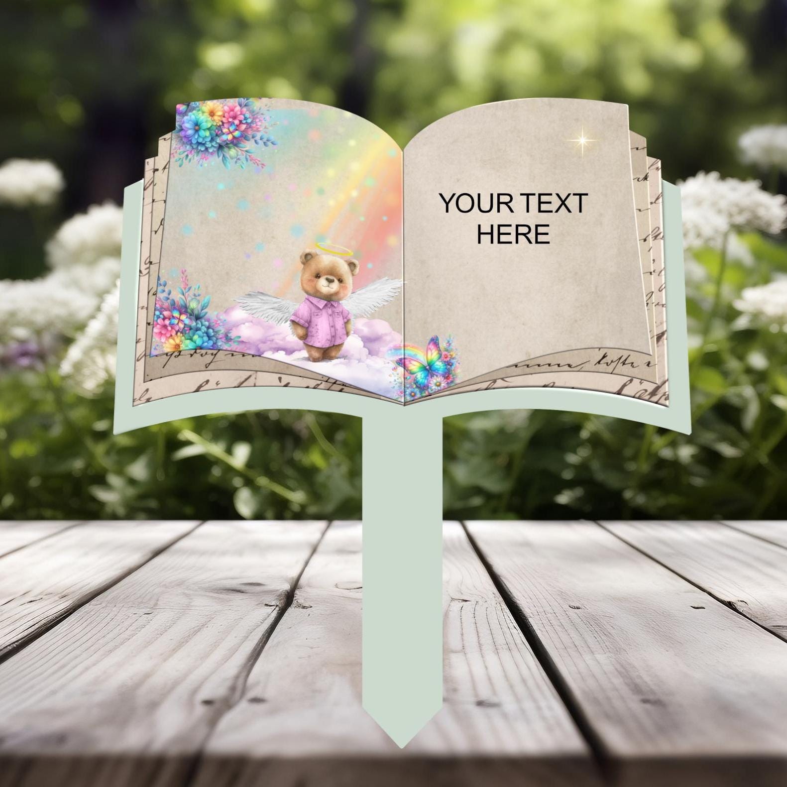 Open book child memorial grave marker with teddy bear design