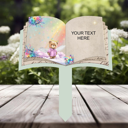 Open book child memorial grave marker with teddy bear design