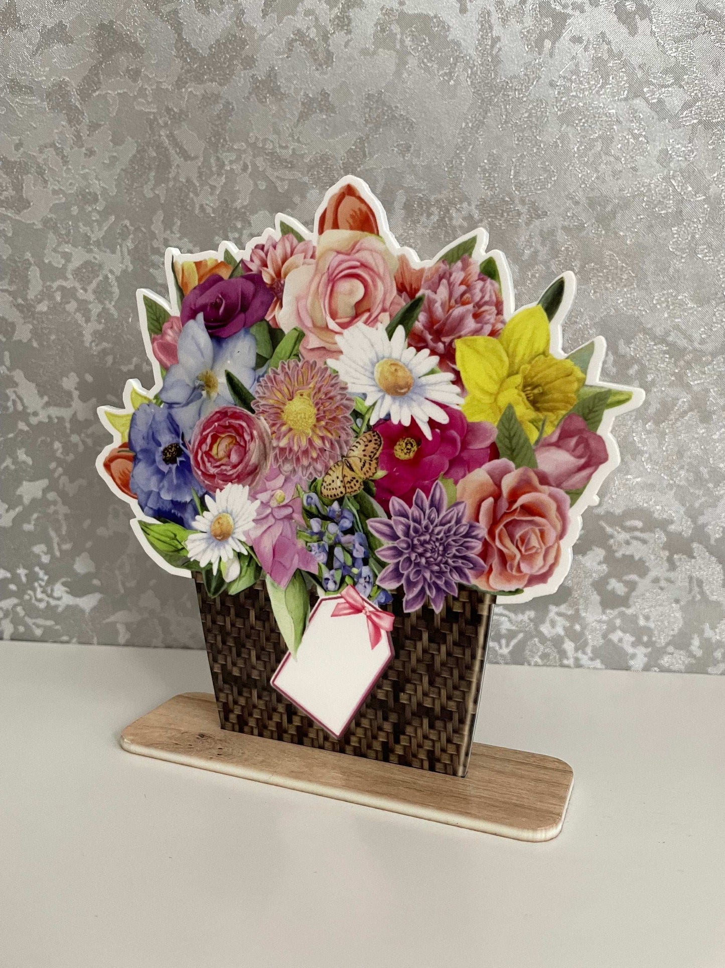 Flower bouquet plaque shown on a windowsill