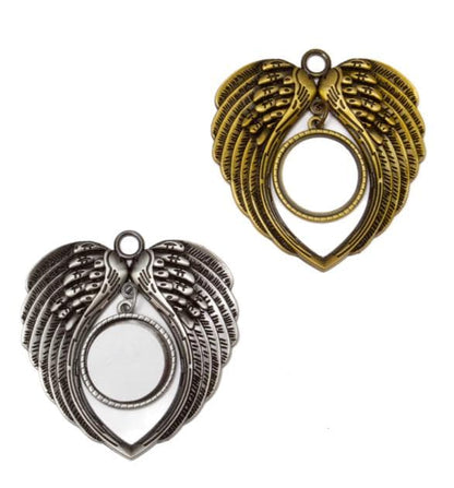 Two angel wing pendants, one gold and one silver, on a white background.