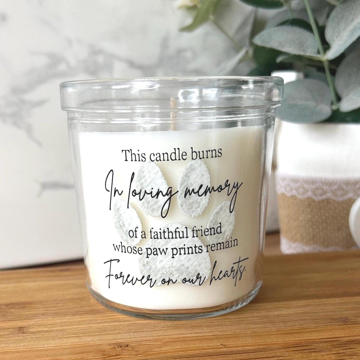Close-up of the paw print detail on the pet memorial candle
