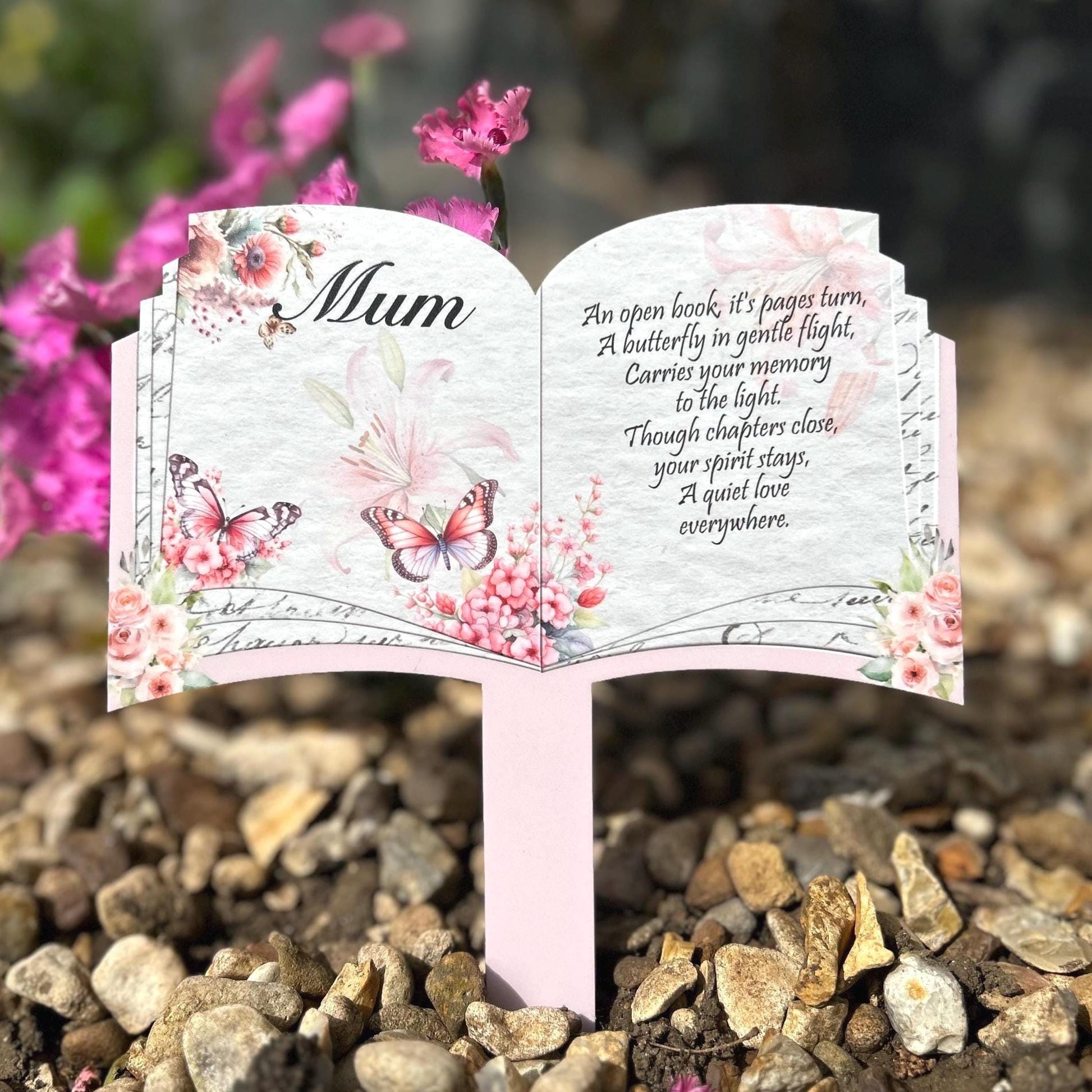Butterfly memorial open book plaque placed at a graveside