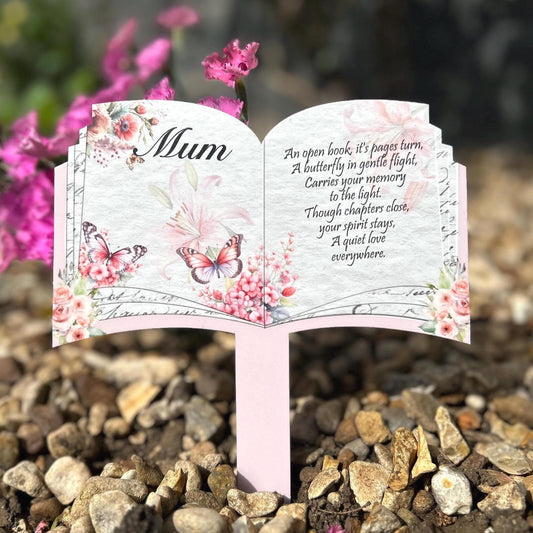 Butterfly memorial open book plaque placed at a graveside