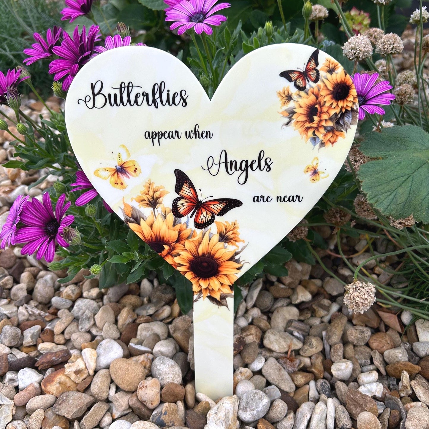 Butterfly heart marker shown in a plant pot to indicate scale