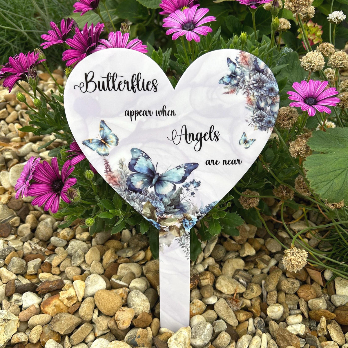 Blue butterfly heart memorial grave marker for a loved one
