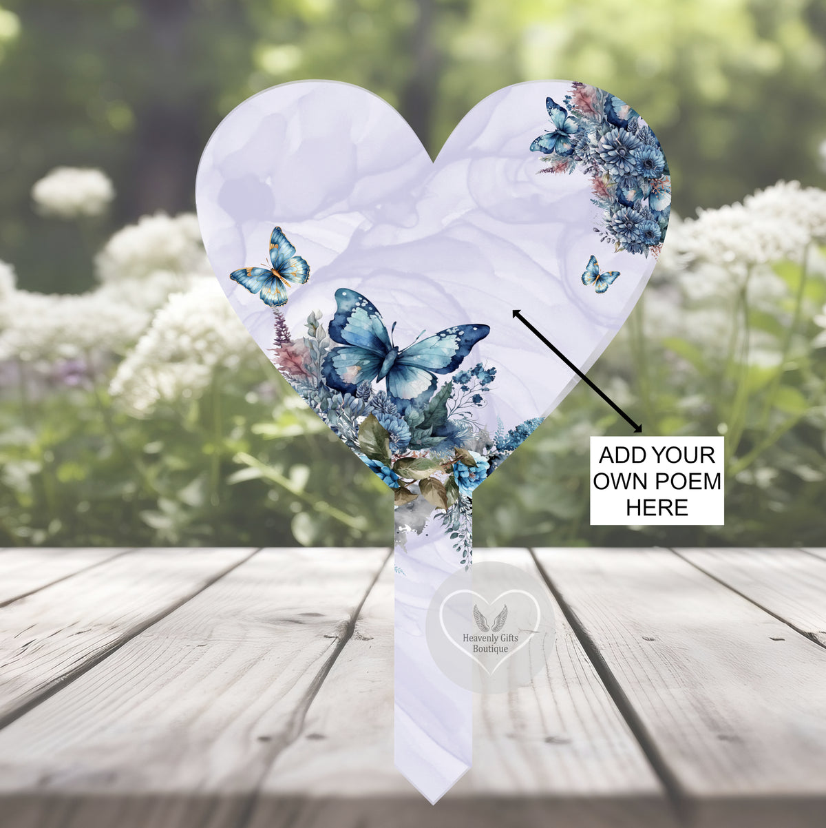 Blue butterfly heart memorial grave marker shown as a graveside tribute