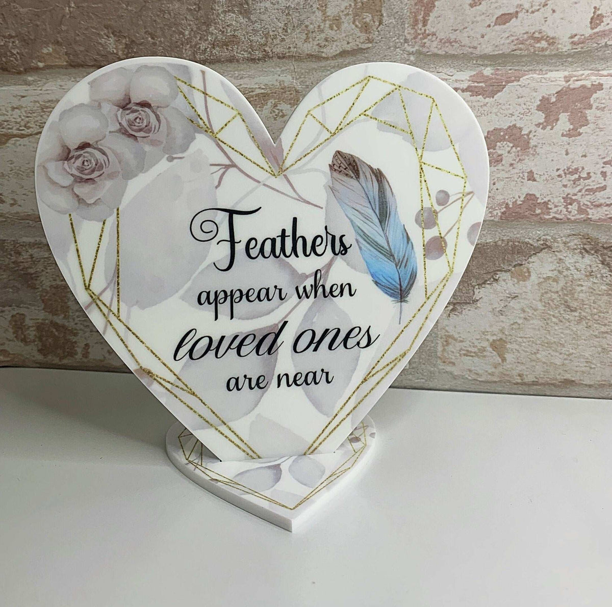 Personalised memorial heart plaque with delicate blue feathers