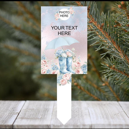 Personalised boots and umbrella graveside memorial tribute