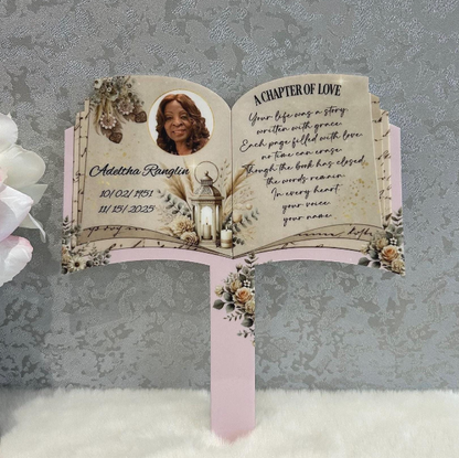 A Chapter of Love open book grave marker with pink floral memorial design