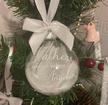 Feather-filled memorial Christmas bauble for a loved one
