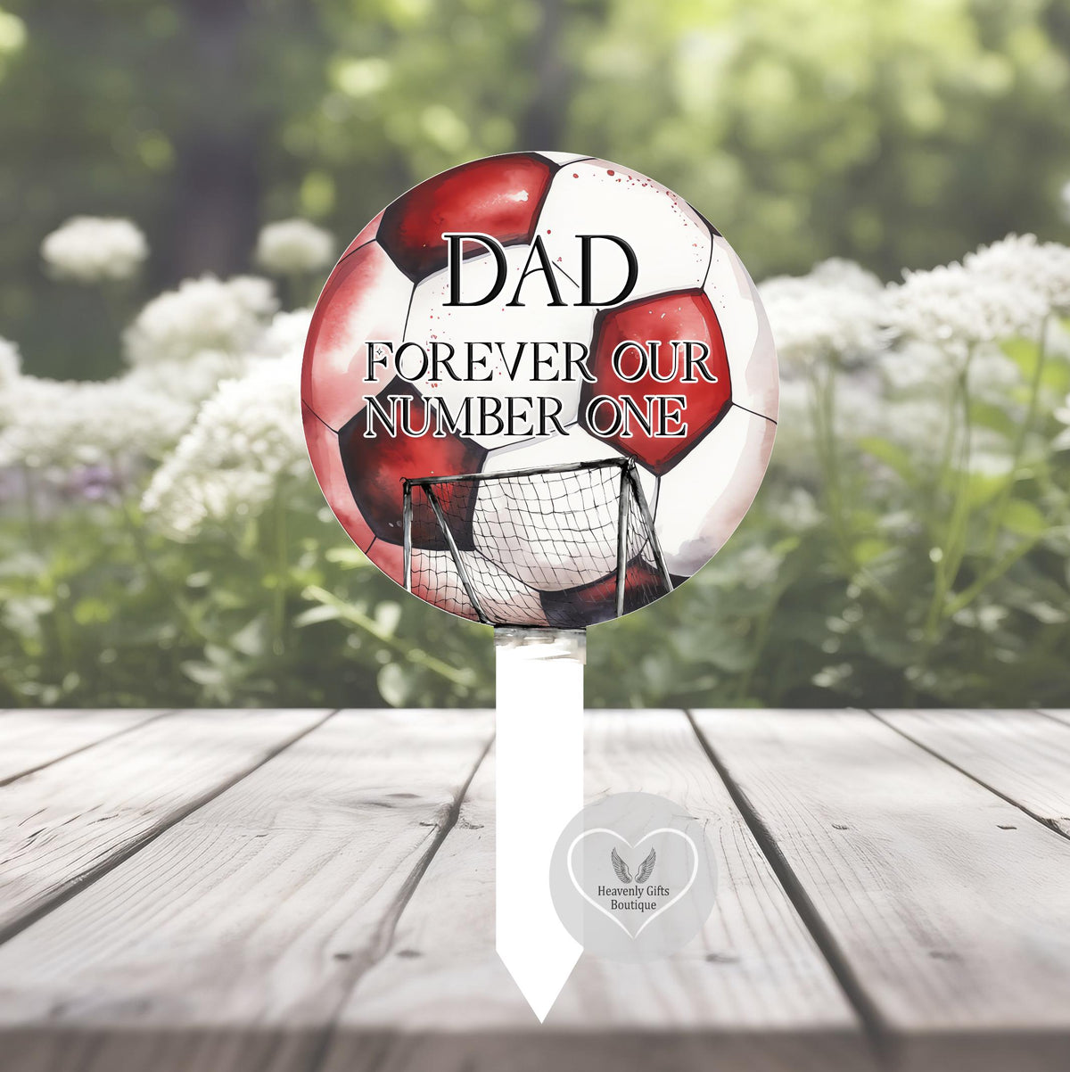 Football shaped grave marker with personalised memorial tribute