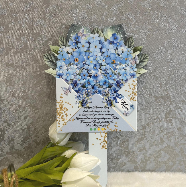 Blue forget-me-not memorial flower marker for graveside remembrance