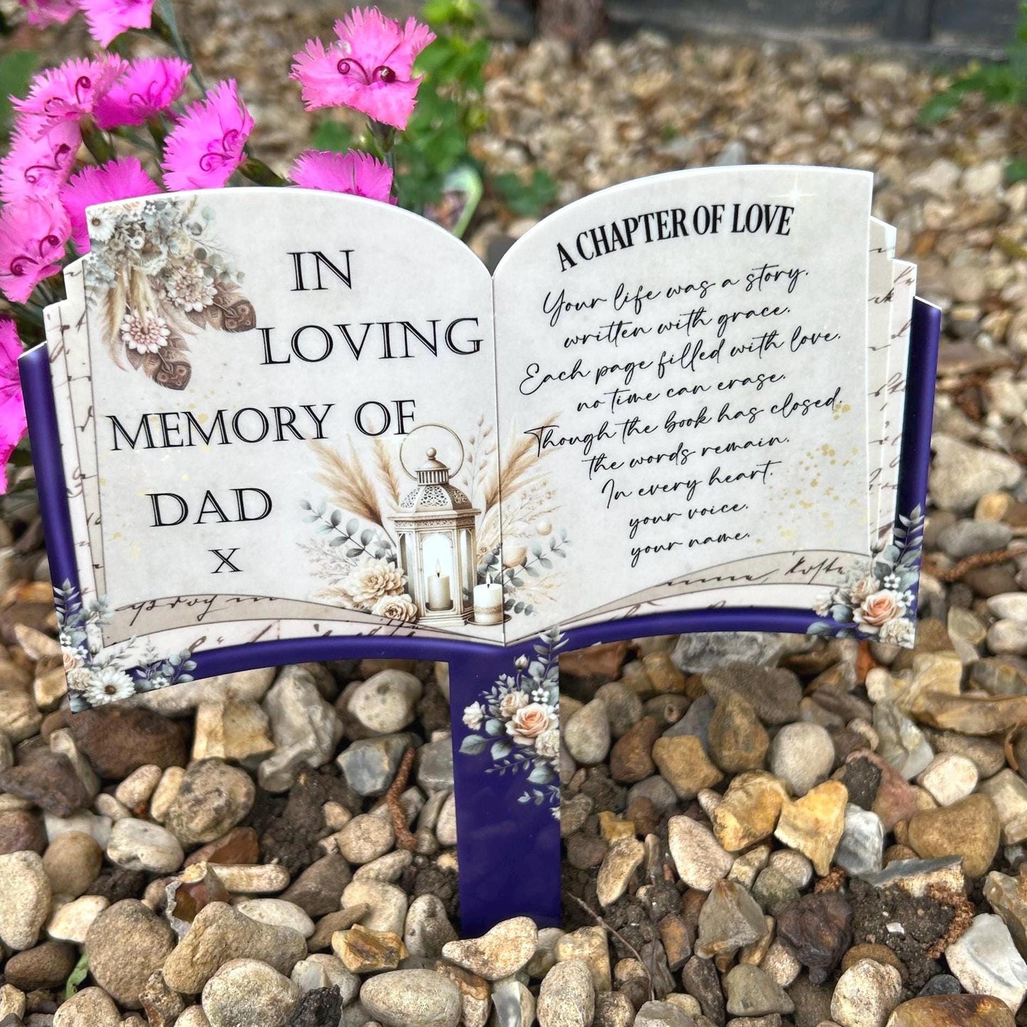 Close-up of personalised lettering on the open book grave marker