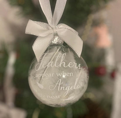 Memorial Christmas bauble filled with delicate white feathers