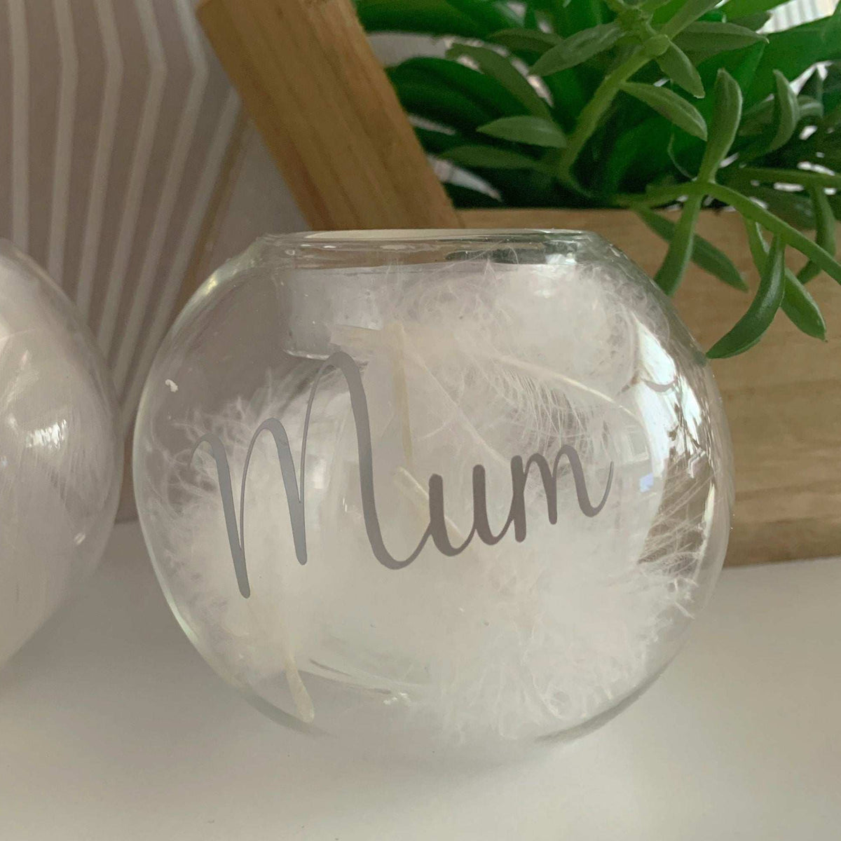 Memorial feather filled glass tealight keepsake for someone deeply missed