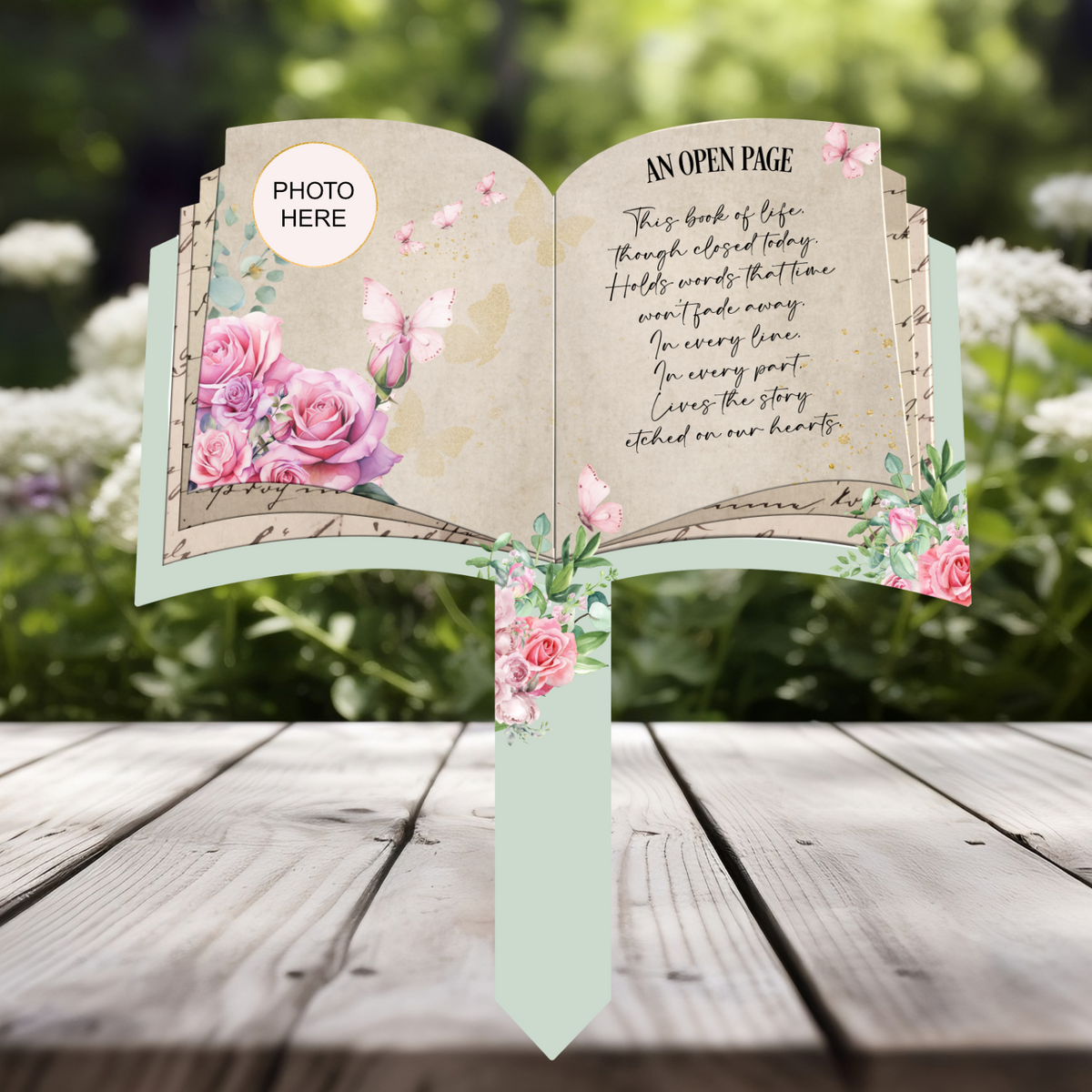 Open book memorial grave marker with pink roses, butterflies, personalised photo and An Open Page remembrance poem