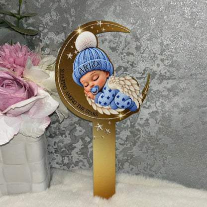 Personalised blue Sleeping Angel Baby grave marker with name Arlo on baby's hat, gold crescent moon, angel wings and Sleeping Among the Stars wording.