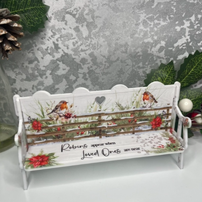 Christmas robin memorial bench with festive poinsettias and remembrance wording