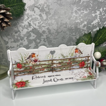 Christmas robin memorial bench with festive poinsettias and remembrance wording