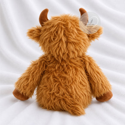 A fluffy brown Highland cow plush toy shown from the back, sitting on a white fabric background.