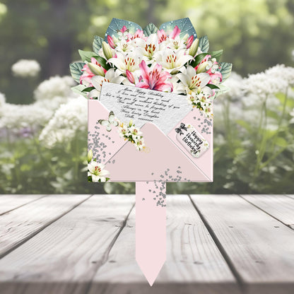 Pink lily personalised memorial bouquet marker for a graveside
