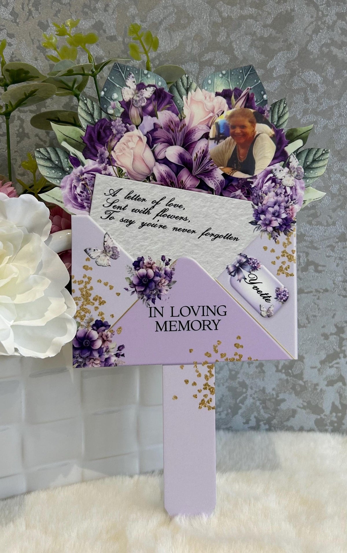 Purple floral memorial grave marker with personalised remembrance design