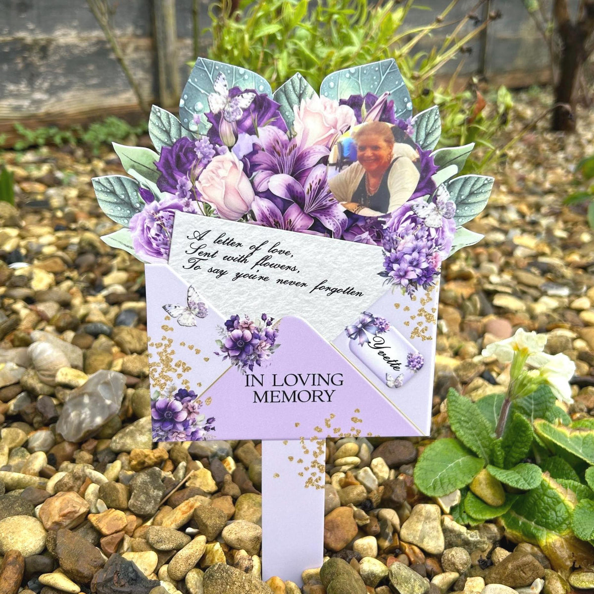 Purple flower memorial bouquet grave marker for a loved one