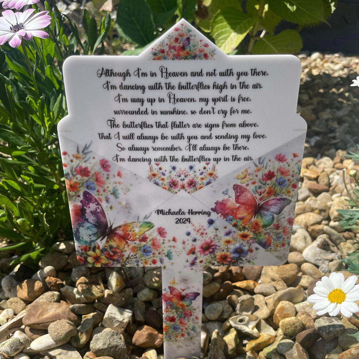 Rainbow butterfly memorial grave marker with remembrance wording