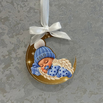 Real photograph of personalised blue Sleeping Angel Baby acrylic memorial bauble with Arlo on the hat, white satin ribbon and bow.