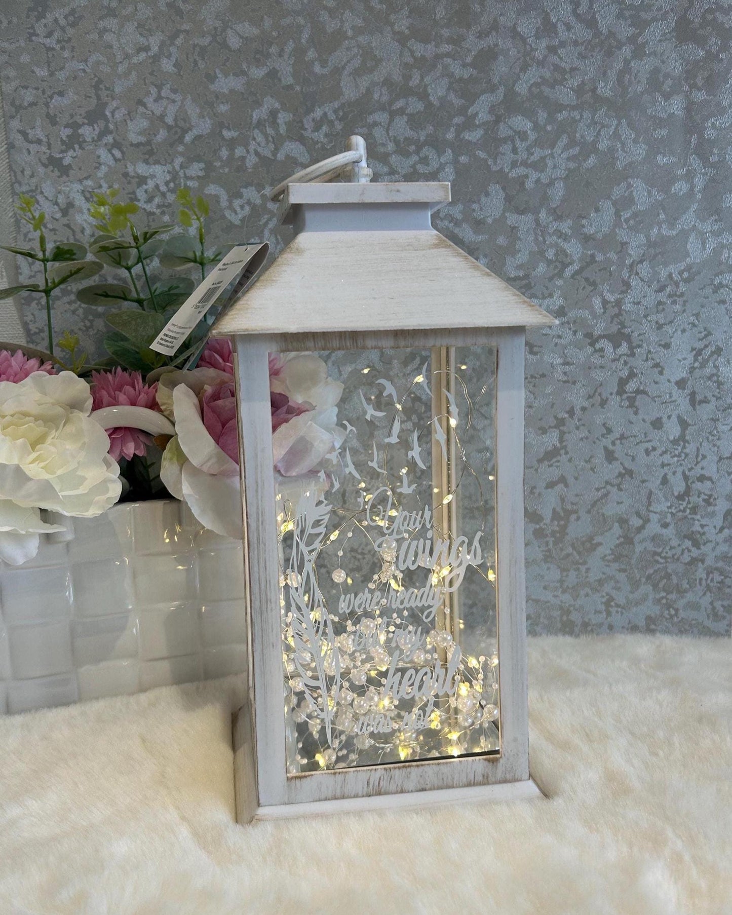 Illuminated white large memorial lantern with warm LED lights and feather design
