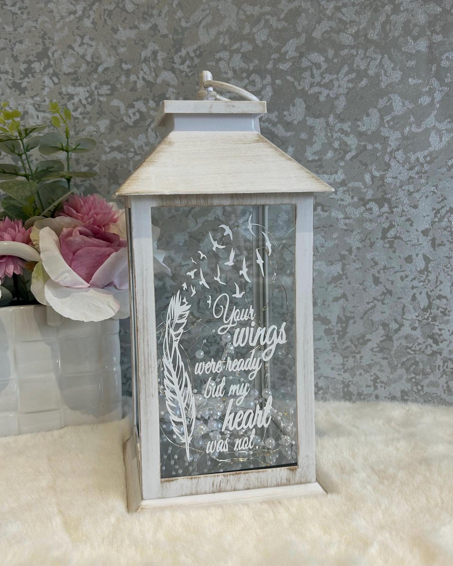 Front view of white large memorial lantern with feather design and remembrance quote
