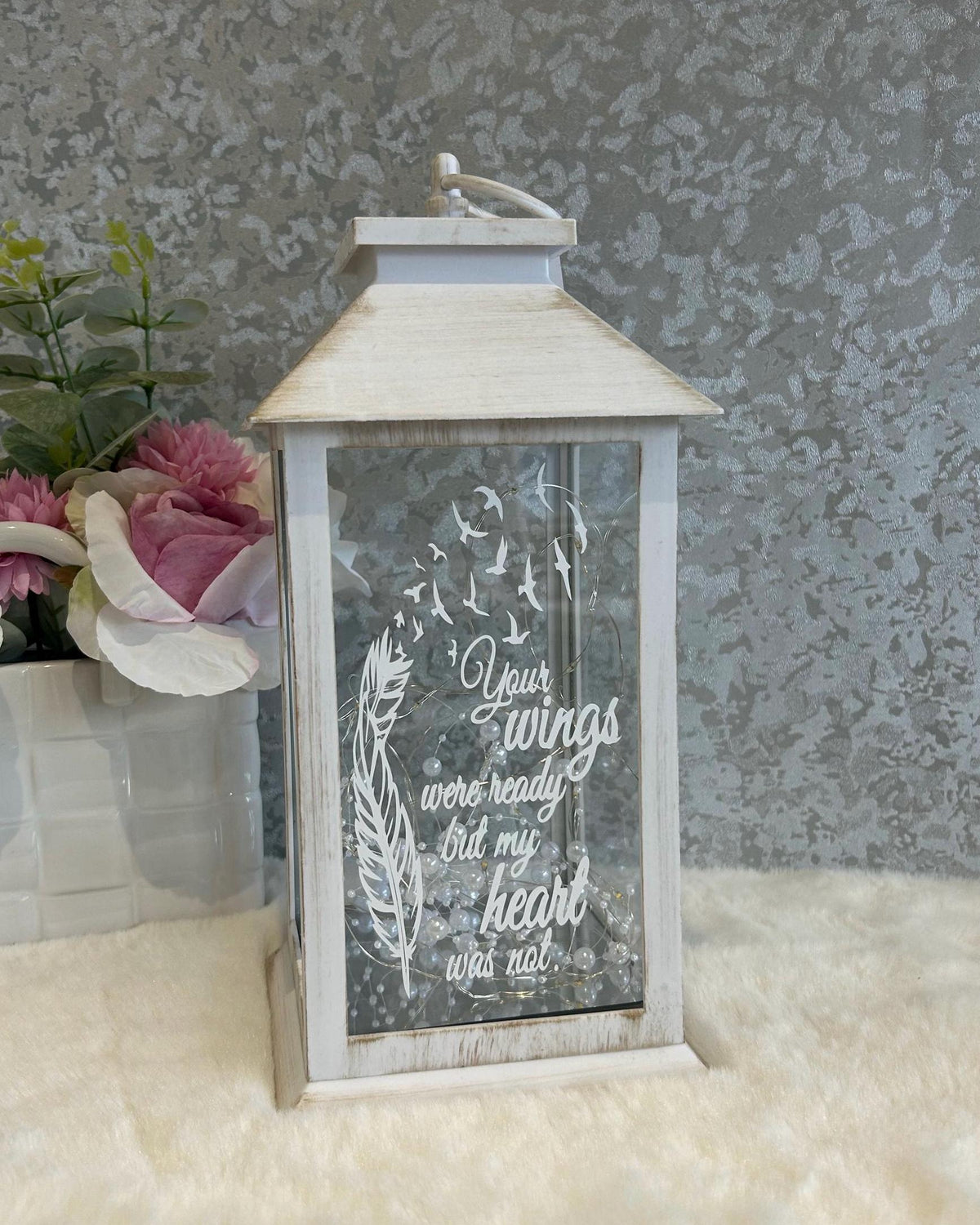 Front view of white large memorial lantern with feather design and remembrance quote